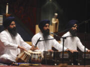 Members of the Guru Ramdass Sikh temple in Vancouver perform a prayer during the Interfaith Service of Thanksgiving on Wednesday evening at St. Joseph Catholic Church in Vancouver.