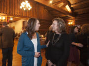 Rep. Jaime Herrera Beutler, left, chats with Lynda Wilson, who is a candidate for the 17th District Senate race, at Summit Grove Lodge in Ridgefield on Tuesday night, Nov. 8, 2016.