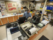 Geophysicist Martin LaFevers looks over a mix of new and old technology for studying volcanoes in a lab Monday at the USGS Cascades Volcano Observatory in Vancouver.