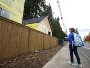 (LEAD) Kaylynn Ward, 12, stops to look at new homes being built in Vancouver on her way home from Cascade Middle School, Monday, November 7, 2016. Kaylynn, her sister Emily Ward and mom, Ginger Marcom, recently lost their home and have been staying with friends and family. The family recently qualified for section 8 housing in Washington. Kaylynn said she hopes to one-day move into the new homes.