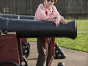 World War II veteran Fred Bridges, dressed in the style of an 1840s Hudson&#039;s Bay company employee, with one of the cannons at the Fort Vancouver National Historic Site. During the Korean War, he was an Army artillery officer with the Cowboy Cannoneers.