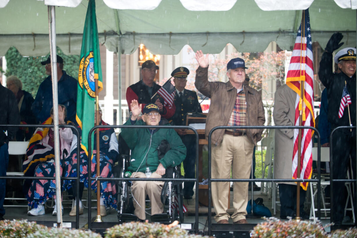 Veterans and their families wave as the Lough Legacy Veterans Parade at Fort Vancouver passes by in 2015. (Molly J.