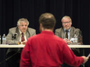 Energy Facility Site Evaluation Council members Bill Lynch, left, and Cullen Stephenson listen Tuesday as Ryan Rittenhouse of Friends of the Columbia Gorge speaks during a hearing on a Vancouver Energy permit.