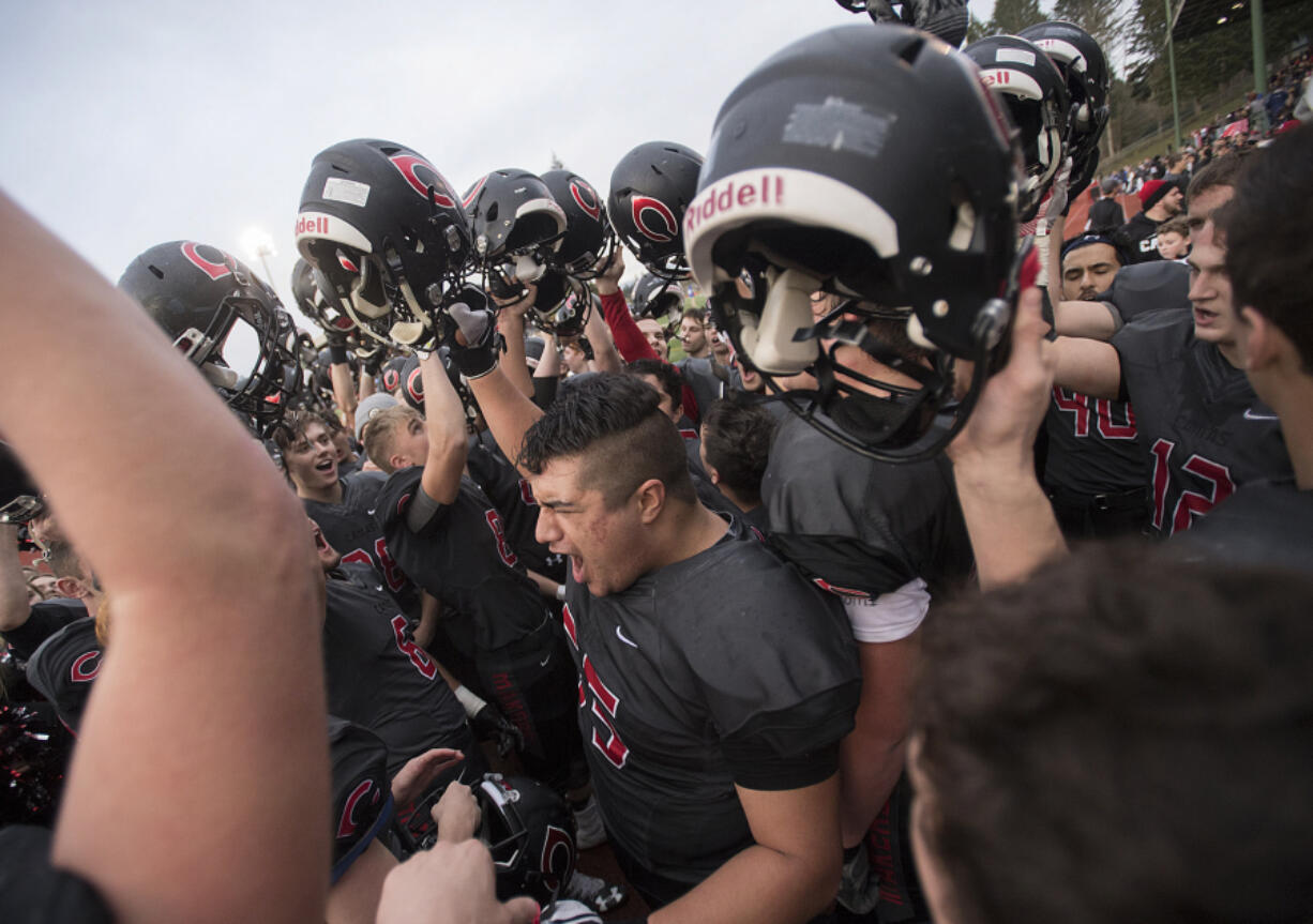 LEADOPTION Camas players celebrate their playoff win over Sumner at McKenzie Stadium on Saturday afternoon, Nov. 26, 2016.