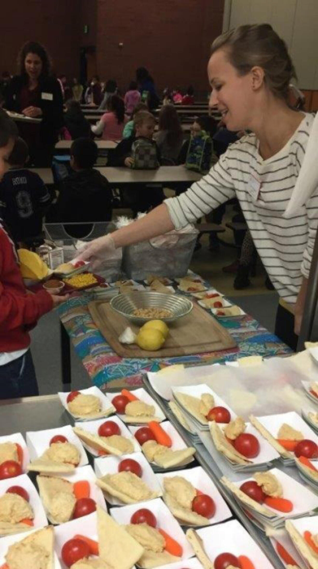 Landover-Sharmel: Anna Weyrauch, a nutrition educator at Washington State University Extension&#039;s Supplemental Nutrition Assistance Program Education, at Endeavour Elementary School for the school&#039;s Harvest of Month campaign, where educators visit elementary schools to help students try new, fresh foods at lunch.