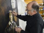 Artist Tom Relth works on a painting of historical figures John and Marguerite McLoughlin in his studio at Boomerang in downtown Vancouver. Relth created the hypothetical marriage portrait by integrating two separate images. The painting will hang at the Fort Vancouver Visitor Center through the end of the year.