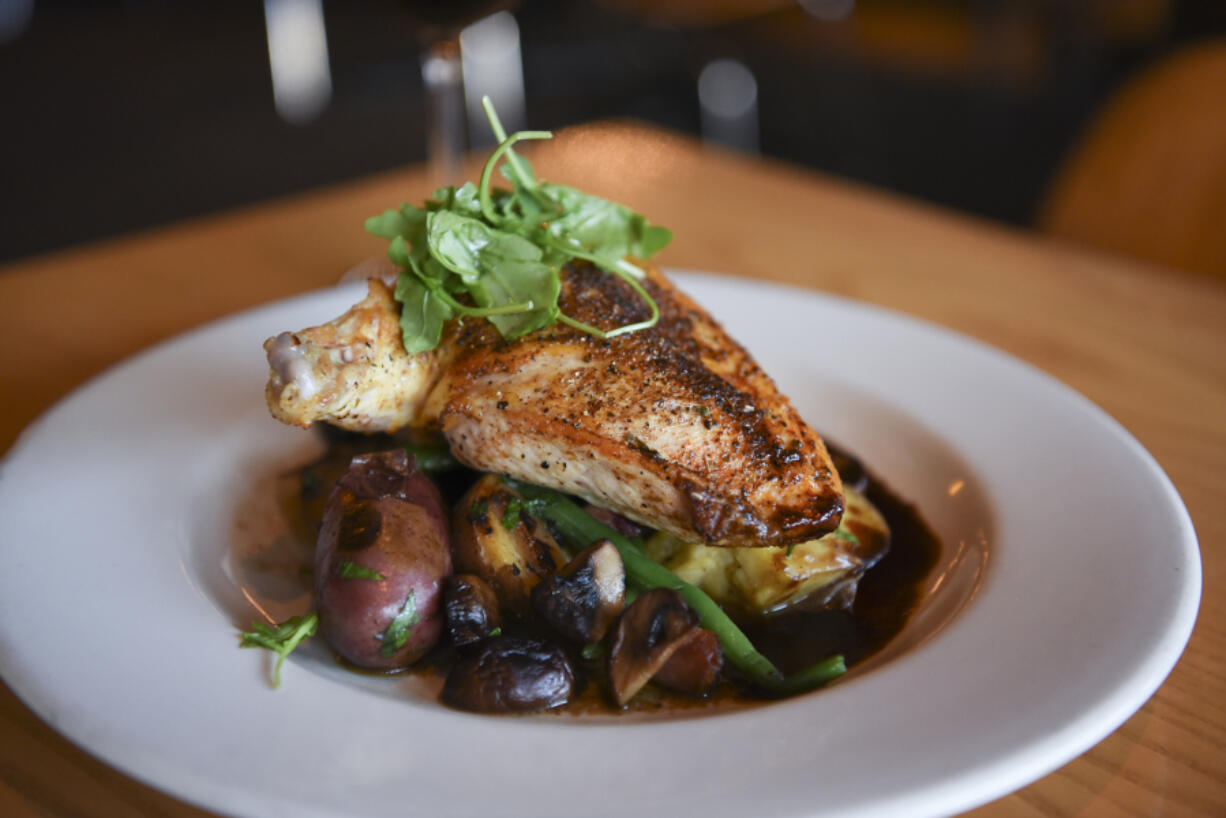 The Draper Valley chicken breast with fingerling potatoes, crimini mushroom, sweet onion, ham and chive hollandaise at Roots Restaurant and Bar in Vancouver, as seen Monday November 28, 2016.