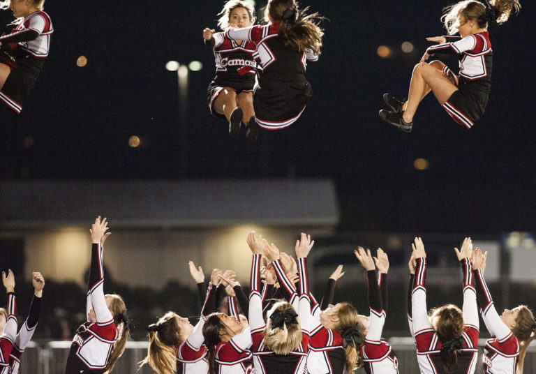 Camas cheerleaders perform during the first playoff game at Doc Harris Stadium in Camas, Friday November 4, 2016.