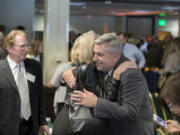 Joe Smith, from left, and his wife, Barbara Kerr, a former Clark College communications officer, congratulate First Citizen Bob Knight at WareHouse &#039;23 in Vancouver on Wednesday afternoon.