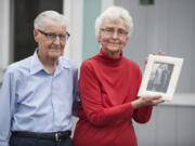 Lowell and Eleanor Lawry recall their early years together while looking at a photo taken of them in 1942, a year after their wedding. The Lawrys will celebrate their 75th wedding anniversary in December.