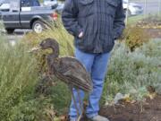 Washougal: Portland metal artist Tom Jackson and his &quot;Golden Back Heron&quot; sculpture, which was unveiled at Washougal City Hall on Nov.