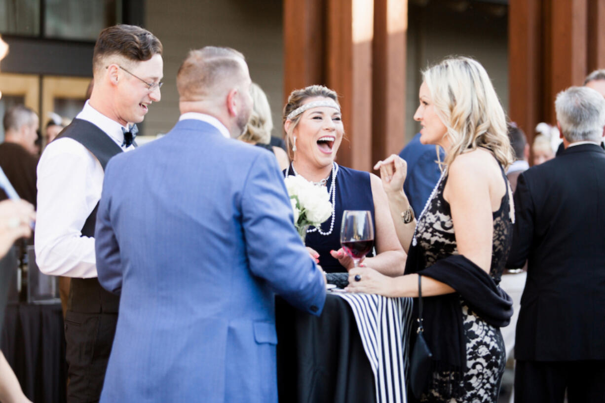 Esther Short: A table of guests at Windermere Stellar&#039;s fourth annual Children&#039;s Justice Center Gala Auction, which raised nearly $200,000 for the center and had an &quot;An Evening With The Great Gatsby&quot; theme.