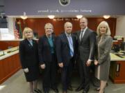 County council members Jeanne Stewart, Julie Olson, Marc Boldt, John Blom and Eileen Quiring gather after a county council meeting at the Clark County Public Service Building.