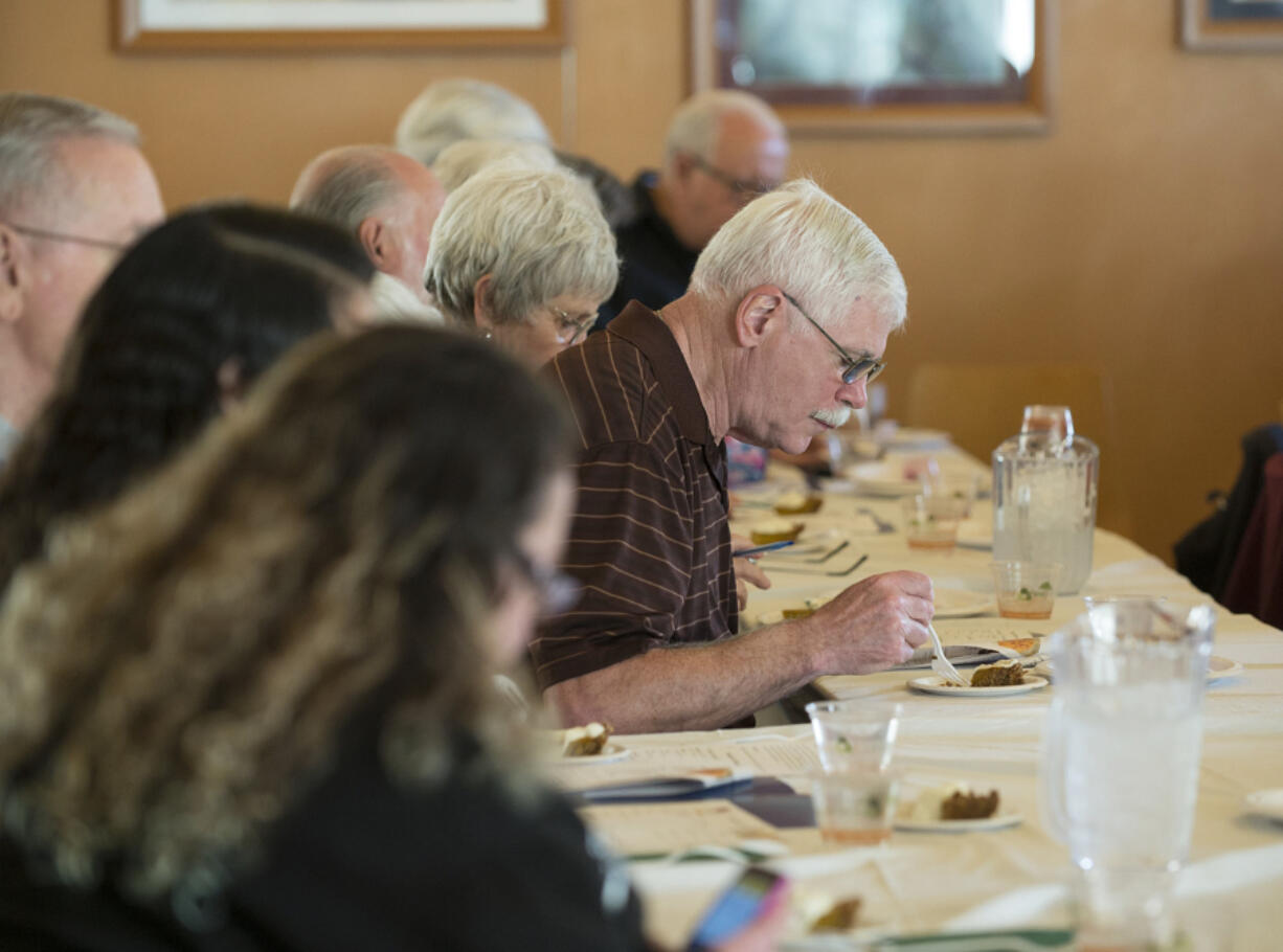 Lloyd Goodpaster of Vancouver, center, tries a slice of reduced-carbohydrate pumpkin pie during a cooking class on diabetic-friendly foods for the holidays Thursday afternoon at Legacy Salmon Creek Medical Center. The diabetic-friendly pie, which uses an almond and walnut crust, has 19 grams of carbs, as opposed to 42 grams in a more traditional pumpkin pie.