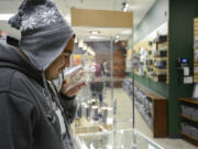 Eloy Cesillos Silva smells the cookies and cream marijuana strain at The Herbery in Vancouver on Nov. 21.