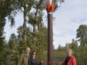 Washougal: Married couple Dave Frei, from left, and Jennifer Corio with Molly Coston, who donated money so the couple could build their &quot;Fire&quot; sculpture as part of Washougal&#039;s &quot;Elements&quot; series of public artwork displayed around the city.