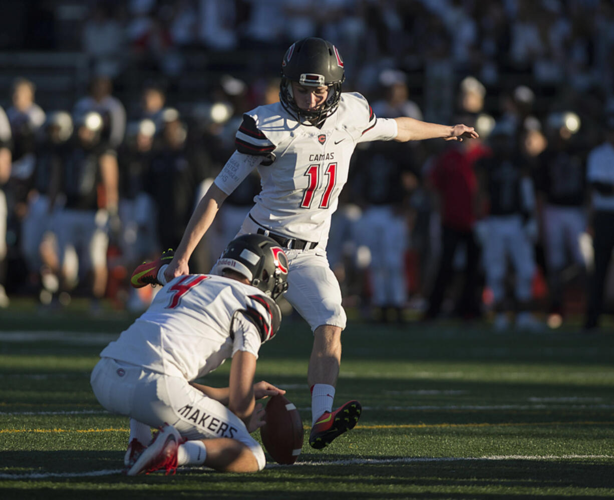 Camas&#039; Michael Boyle (11) kicks an extra point in the first half against Union at McKenzie Stadium on Friday night, Oct. 28, 2016.