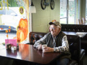 Ernie Fedrick, 88, enjoys a cup of black coffee at the Countree Kitchen & Timbers Saloon in Amboy. Fedrick supported President-elect Donald Trump but hopes the country becomes more unified and cuts back on some of the divisive talk.