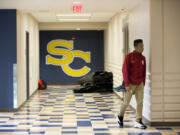 Freshman Tyvauntae Delony, 15, walks through a hallway at Seton Catholic College Preparatory High School on Tuesday morning. After seven years in a much smaller space, the school unveiled its new campus this fall.