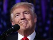 President-elect Donald Trump smiles as he arrives to speak at an election night rally, Wednesday, Nov. 9, 2016, in New York.