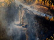 A flame continues to burn after a Monday explosion of a Colonial Pipeline on Tuesday in Helena, Ala. The blast, which sent flames and thick black smoke soaring over the forest, happened about a mile west of where the pipeline ruptured in September, Gov. Robert Bentley said in a statement.