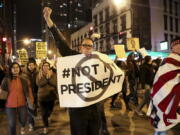 Protesters march North on State Street to express their disapproval of the election of Donald Trump on Wednesday in Chicago.