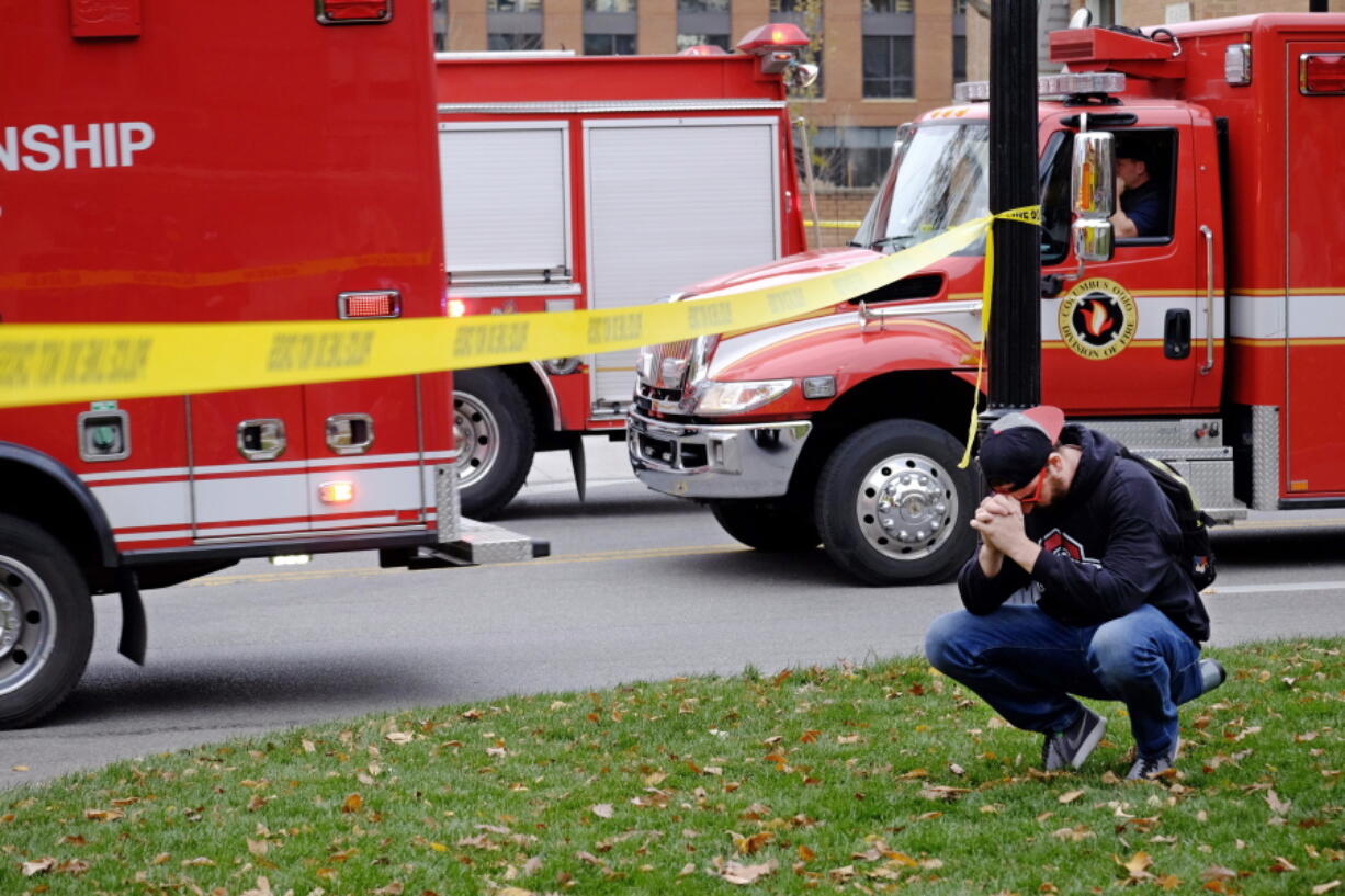 Student Nicholas Flores reacts as police respond to an attack on campus at Ohio State University on Monday in Columbus, Ohio. Multiple people were injured in the attack and a suspect was shot, school and hospital officials said.