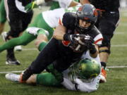 Oregon State running back Ryan Nall, top, dives over Oregon&#039;s Danny Mattingly for a touchdown in the second half an NCAA college football game in Corvallis, Ore., Saturday Nov. 26, 2016. (AP Photo/Timothy J.