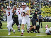 Stanford running back Christian McCaffrey (5) scores his second touchdown in the first quarter of an NCAA college football game Saturday, Nov. 12, 2016, in Eugene, Ore.