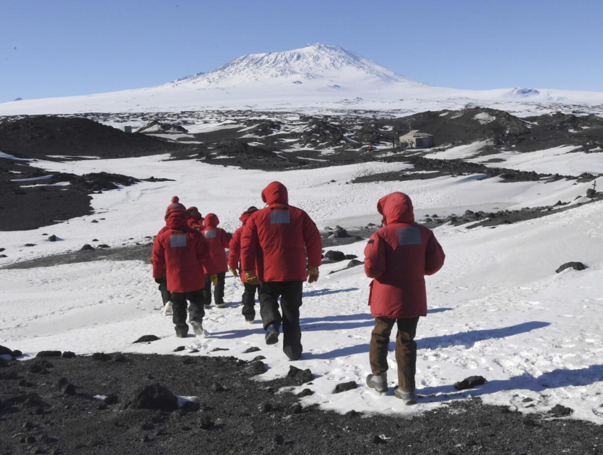 U.S. Secretary of State John Kerry and members of his delegation hike toward the historic Shackleton hut Friday near McMurdo Station, Antarctica.