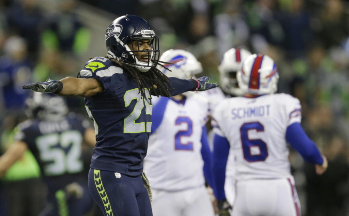 Seattle Seahawks cornerback Richard Sherman (25) signals no good after Buffalo Bills kicker Dan Carpenter (2) failed to kick a field goal in the first half on Monday.