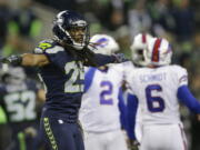 Seattle Seahawks cornerback Richard Sherman (25) signals no good after Buffalo Bills kicker Dan Carpenter (2) failed to kick a field goal in the first half on Monday.