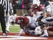 Washington State running back Gerard Wicks (23) runs for a touchdown during the first half of an NCAA college football game against California in Pullman, Wash., Saturday, Nov. 12, 2016.