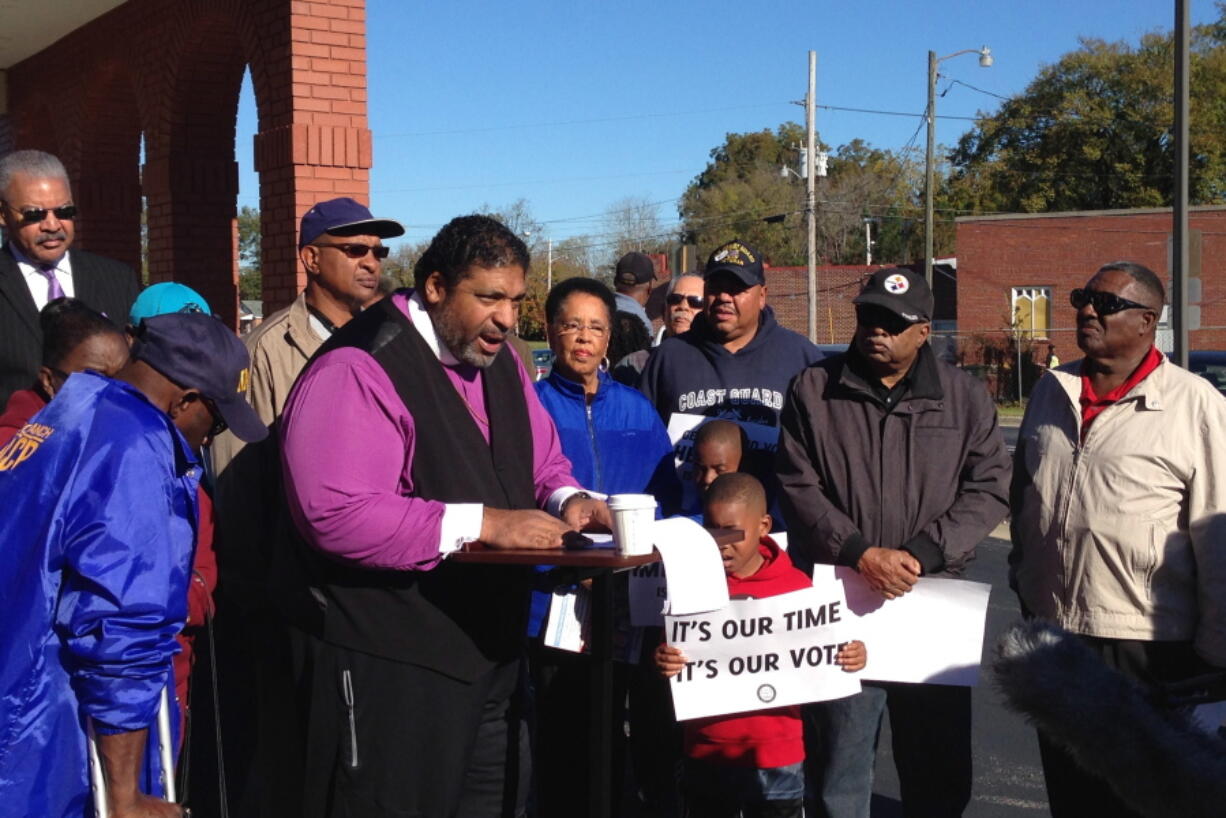 The Rev. William Barber, president of the North Carolina state NAACP, speaks during a news conference Saturday in Wilson, N.C. Voting activists and volunteers fanned out over the presidential battleground of North Carolina on Saturday&#039;s final day of early in-person voting to urge undecideds and the otherwise uninterested to cast ballots in close races for president, U.S. Senate and governor.