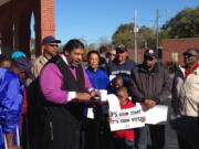 The Rev. William Barber, president of the North Carolina state NAACP, speaks during a news conference Saturday in Wilson, N.C. Voting activists and volunteers fanned out over the presidential battleground of North Carolina on Saturday&#039;s final day of early in-person voting to urge undecideds and the otherwise uninterested to cast ballots in close races for president, U.S. Senate and governor.