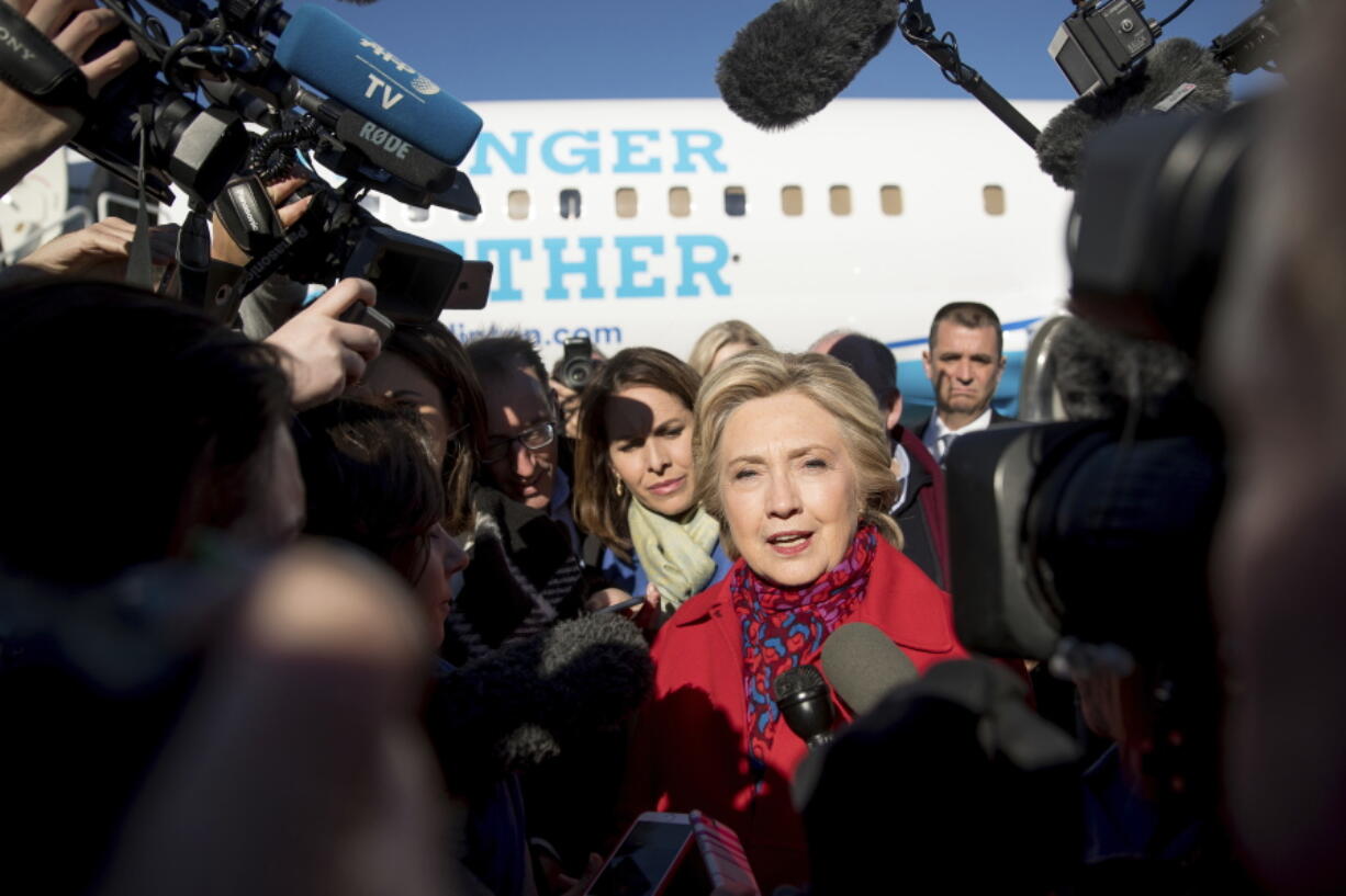 Democratic presidential candidate Hillary Clinton speaks to members of the media before boarding her campaign plane at Westchester County Airport in White Plains, N.Y., on Monday to travel to Pittsburgh.