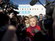 Democratic presidential candidate Hillary Clinton speaks to members of the media before boarding her campaign plane at Westchester County Airport in White Plains, N.Y., on Monday to travel to Pittsburgh.