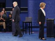 Republican presidential candidate Donald Trump, left, and Democratic presidential candidate Hillary Clinton walk to their chairs as they arrive for the second presidential debate at Washington University in St. Louis. Andrew Cullison, a professor at DePauw University in Indiana who is studying skepticism and its relation to contemporary politics, says the internet has allowed lies to gain traction and for people to insulate themselves from those who disagree. He says controlled studies have found that, even when provided evidence that something is false, many simply double-down and increase their level of confidence in a belief's validity.