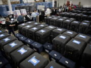 Ballot tabulator machines are checked twice before election judges perform a public accuracy test at the Minneapolis Elections &amp; Voters Services equipment warehouse on Tuesday, Nov. 1, 2016, in Minneapolis.