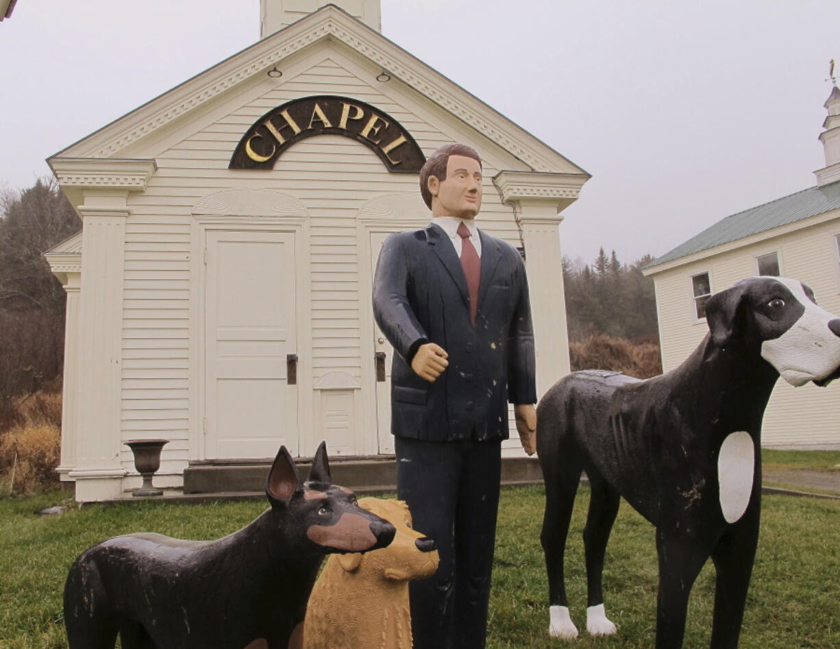 Statues stand in front of the Dog Chapel at Dog Mountain in St. Johnsbury, Vt., a 150-acre haven for canines and their owners. Inside the chapel, the walls are covered with notes from pet owners about their dogs who have died.