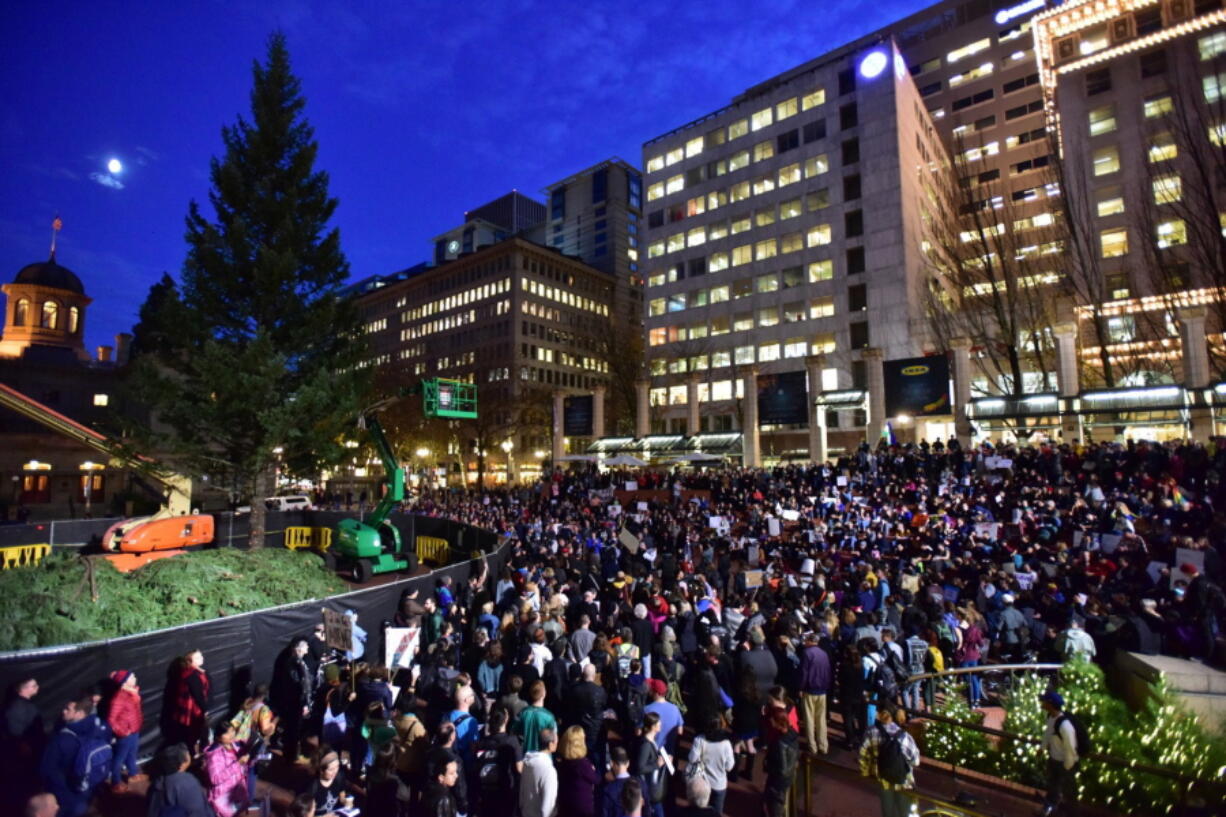 Protesters gather in Pioneer Courthouse Square in Portland, the third night of protests over the results of the 2016 U.S. presidential election Thursday. President-elect Donald Trump fired back on social media after demonstrators in both red and blue states hit the streets for another round of protests, showing outrage over the Republican&#039;s unexpected win.