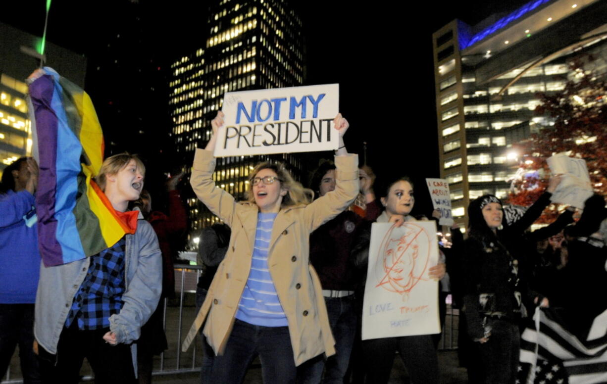 Protesters Donald Trump&#039;s presidential election march around Campus Martius Park on Wednesday in Detroit.   A day after Trump&#039;s election to the presidency, campaign divisions appeared to widen as many thousands of demonstrators  flooded streets across the country to protest his surprise triumph.