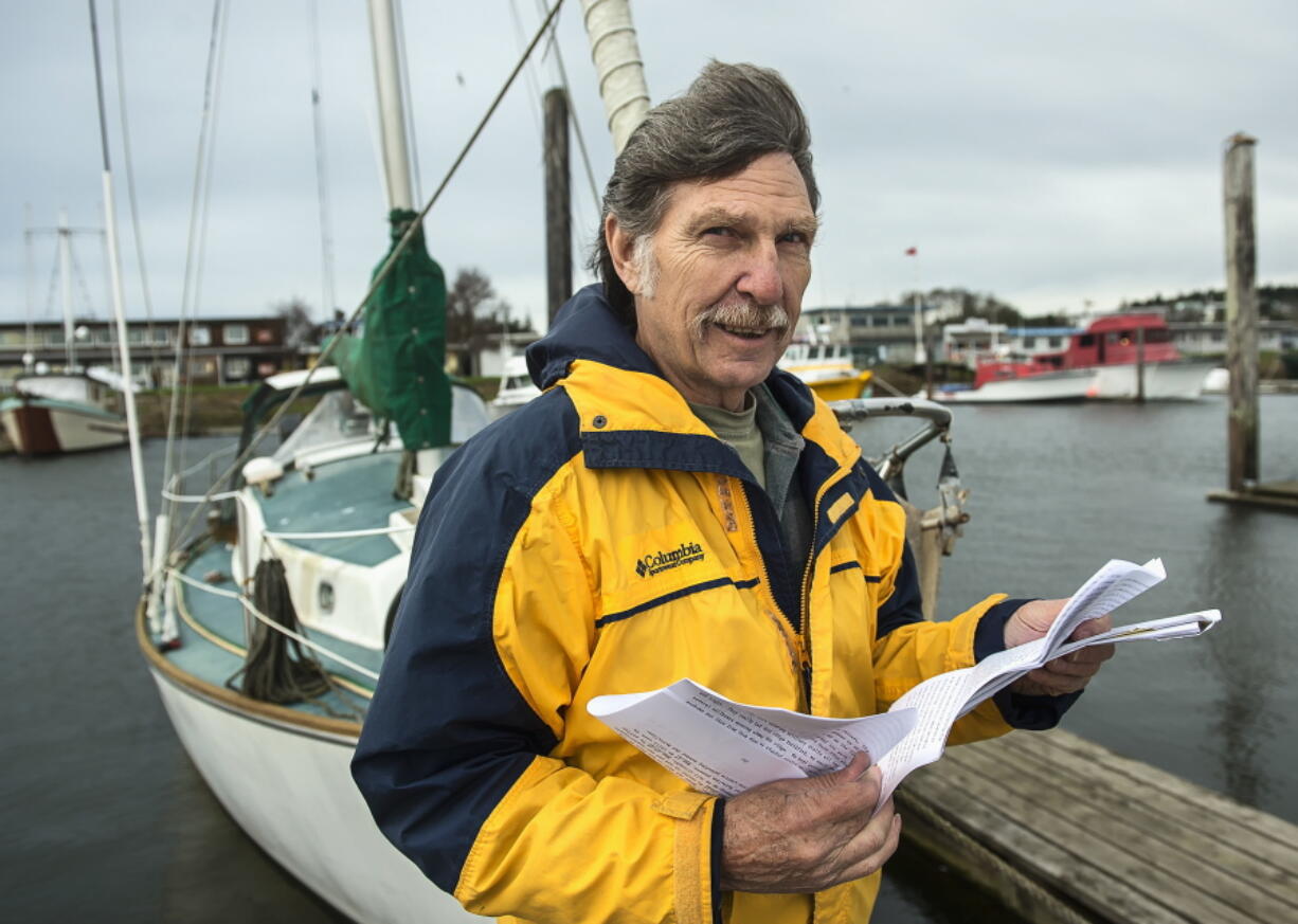 Desmond Doss Jr. holds correspondence about his father, the subject of the film &quot;Hacksaw Ridge,&quot; on Nov. 18 while on a dock in Ilwaco. Doss Jr. has been flooded with emails and letters regarding his father, a World War II soldier who refused to touch a gun and who rescued 75 wounded soldiers.