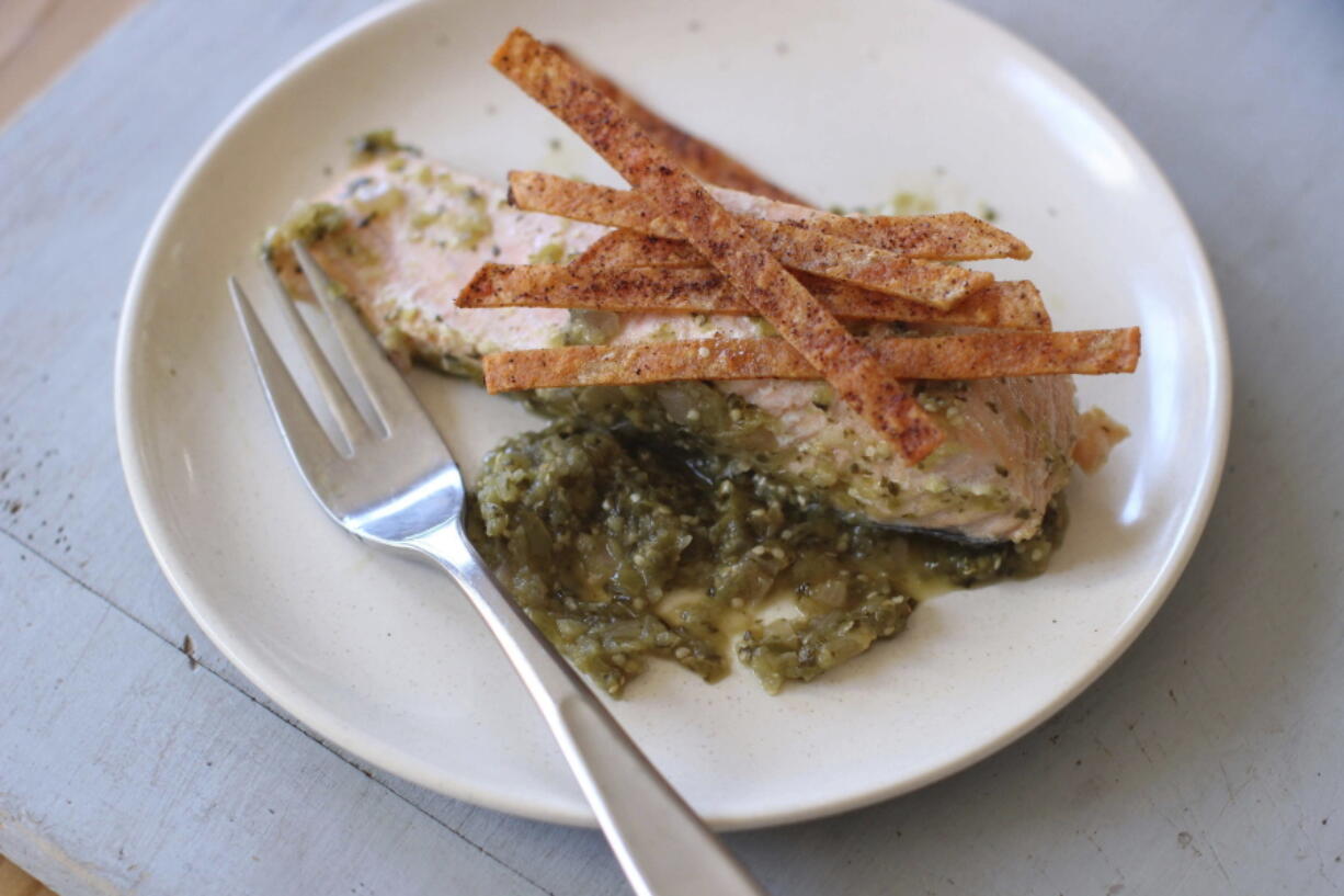 Salmon poached in green salsa and topped with baked chips (AP Photo/Matthew Mead)