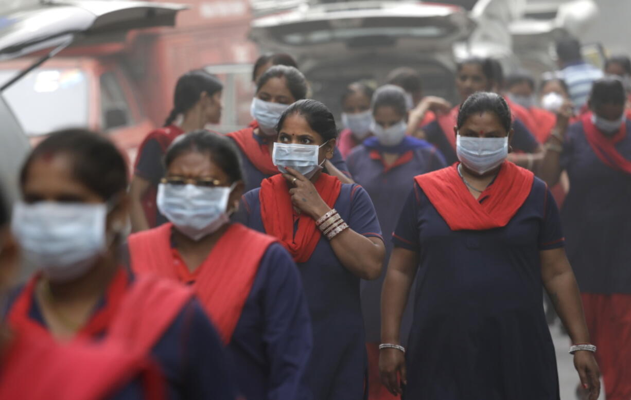 Indian women wearing pollution masks arrive to a protest against air pollution Sunday in New Delhi, India. Even for a city considered one of the world&#039;s dirtiest, the Indian capital hit a new low this week. Air so dirty you can taste and smell it; a gray haze that makes a gentle stroll a serious health hazard. According to one advocacy group, government data shows that the smog that enveloped the city midweek was the worst in the last 17 years. The concentration of PM2.5, tiny particulate pollution that can clog lungs, averaged 12 times the government norm and a whopping 70 times the WHO standards.