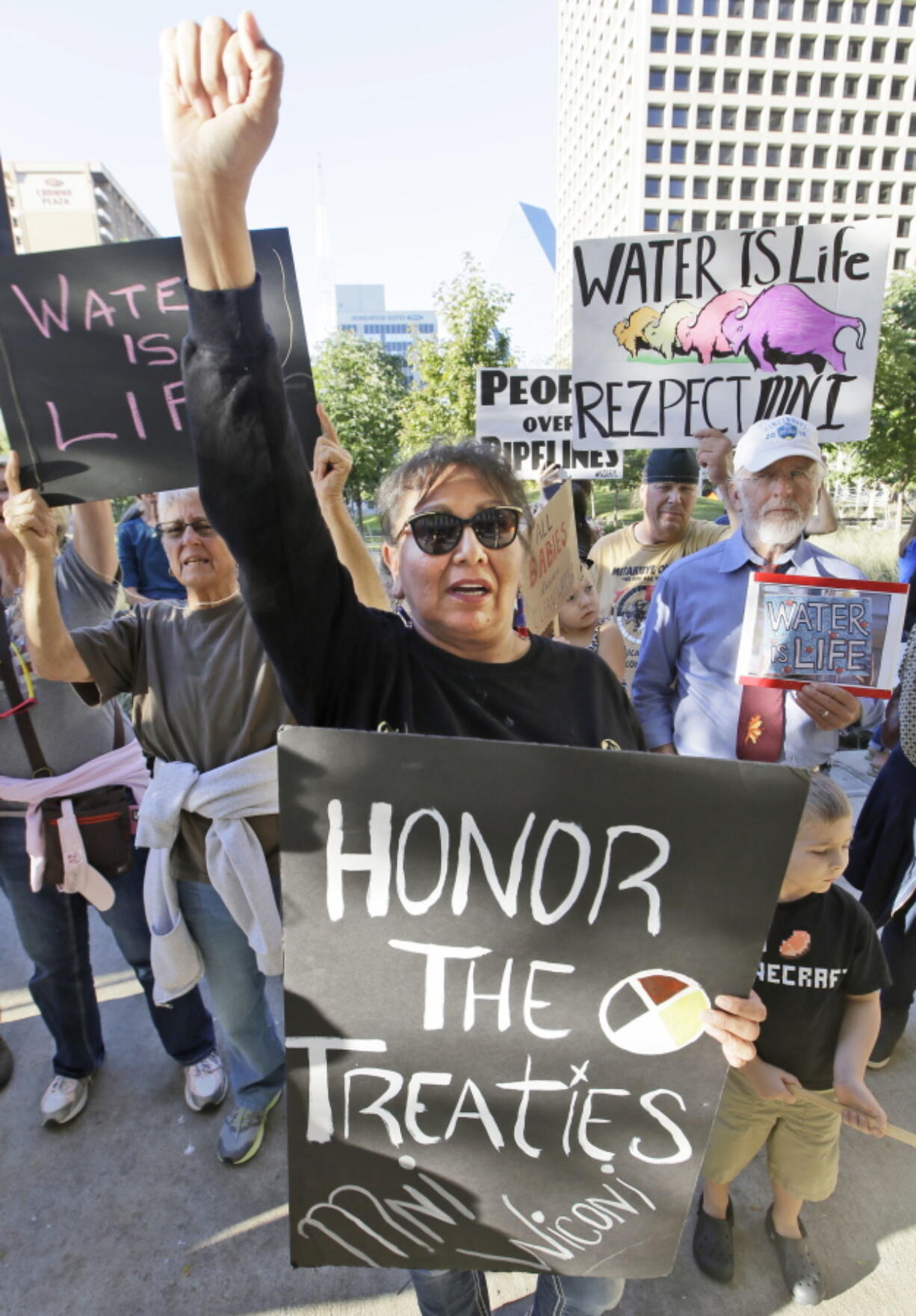 Lakota Sioux Henrietta Nelson protests with others  outside the Army Corps of Engineers offices on Tuesday in Dallas. People across the U.S. gathered to show solidarity with opponents of the Dakota Access oil pipeline.