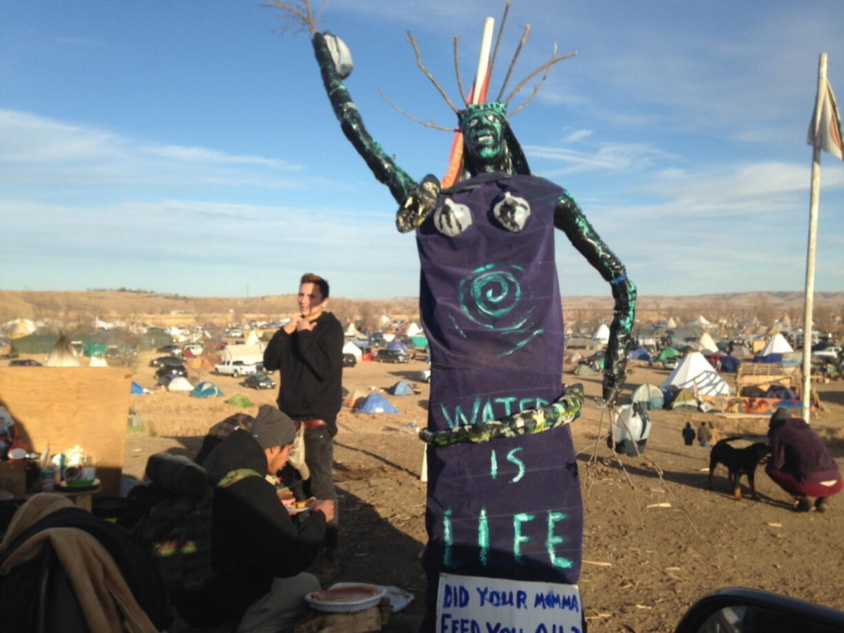 A sculpture stands at an encampment where protesters of the Dakota Access oil pipeline have been gathered for months Saturday near Cannon Ball, N.D.