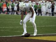 Oregon defensive back Mattrell McGraw (9) stares at the ball after dropping a kickoff from Southern California .