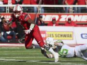 Oregon linebacker Troy Dye (35) dives and sacks Utah quarterback Troy Williams (3) in the first half of an NCAA college football game, Saturday, Nov. 19, 2016, in Salt Lake City.