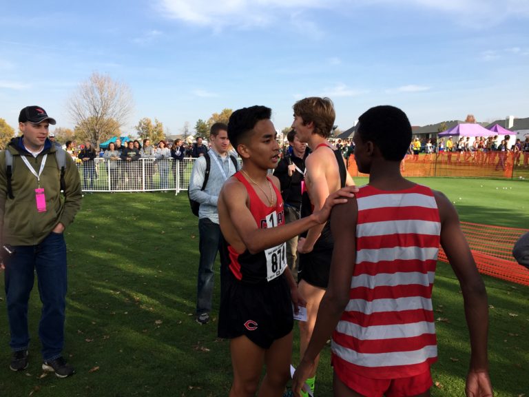 Yacine Guermali of Camas talks with fellow runners after he won the Class 4A race at the State Cross Country Championships on Saturday in Pasco.